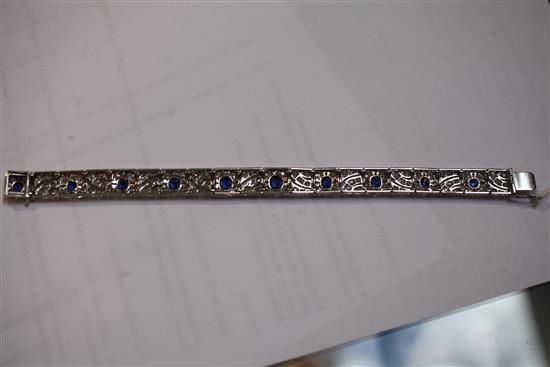 An attractive 1920s pierced white gold, sapphire and diamond bracelet, 18cm.